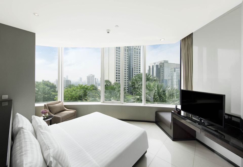 Guest room with city outlook — Grande Centre Point Hotel Terminal21