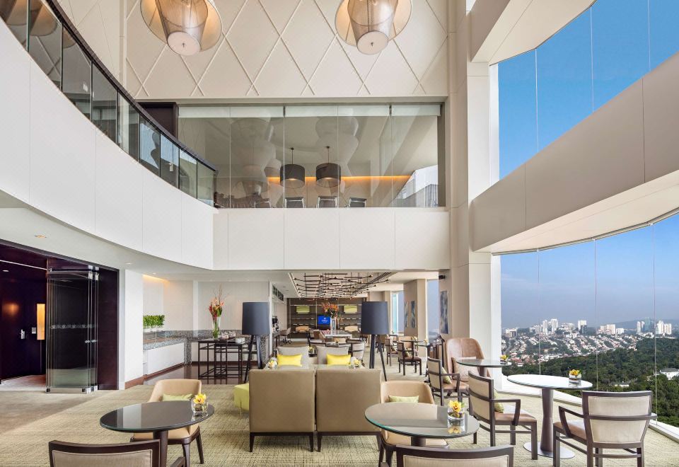 High-ceiling interior seating — Hilton Kuala Lumpur